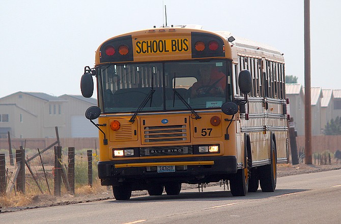A school bus returns from dropping off students after the second day of school last week.