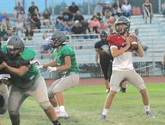 Fallon quarterback Keaton Williams looks downfield for a receiver in a Friday night scrimmage at the Edward Arciniega Athletic Complex.