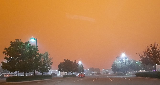 Gardnerville resident Mary Hartnett took this photo of the streetlights on at the Smith's due to the smoke on Tuesday. The R-C received more than a dozen photos from readers. We'll get as many in as we can over the next couple of issues.