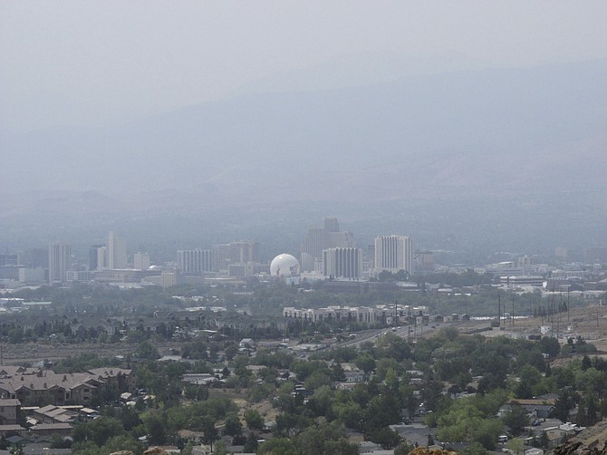 Smoke from wildfires in California blankets Reno on Wednesday, Aug. 18, 2021. (AP Photo/Scott Sonner)
