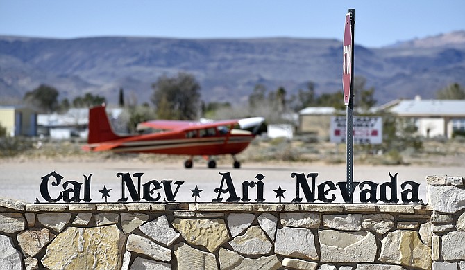 A small single-engine plane is parked just outside the Cal-Nev-Ari Casino in Cal-Nev-Ari, Nev., on Feb. 25, 2016. (David Becker/Las Vegas Review-Journal via AP)