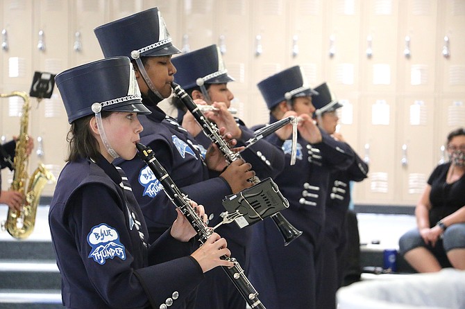 Blue Thunder clarinet and flute players demonstrate their skills during Wednesday’s parent preview in Carson High School’s Senator Square. (Photo: Jessica Garcia/Nevada Appeal)