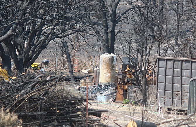 Work is ongoing at a property along Highway 395 to recover after the Tamarack Fire claimed homes.