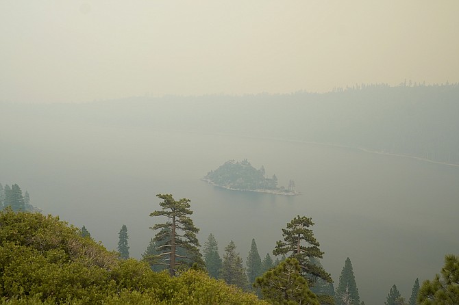 Lake Tahoe's Emerald Bay is shrouded in smoke from the Caldor Fire, near South Lake Tahoe, Calif., on Aug. 24, 2021. (AP Photo/Rich Pedroncelli)