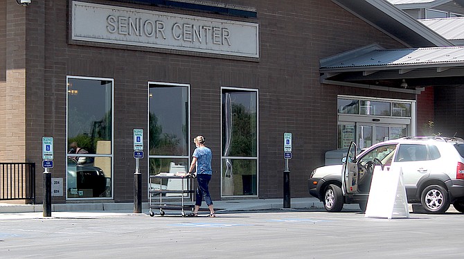 Meals at the Douglas County Community & Senior Center will be served curbside again next week after the center is an active evacuation center for the Caldor Fire.