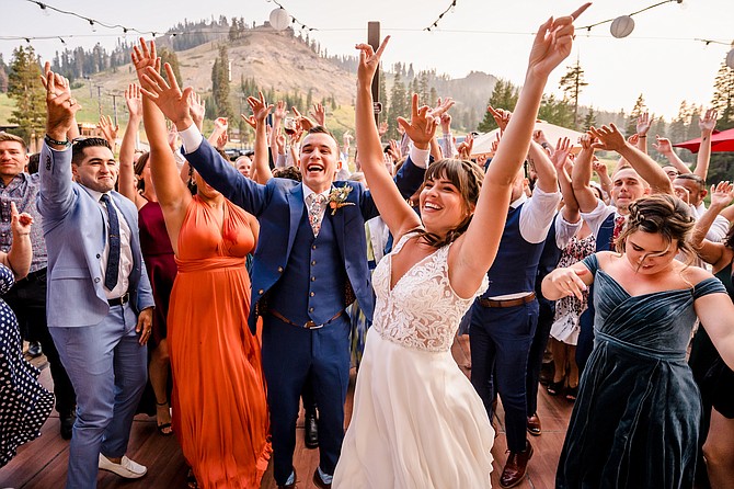 A bride and groom and their guests dance during a wedding held at Lake Tahoe on Aug. 14, 2021.