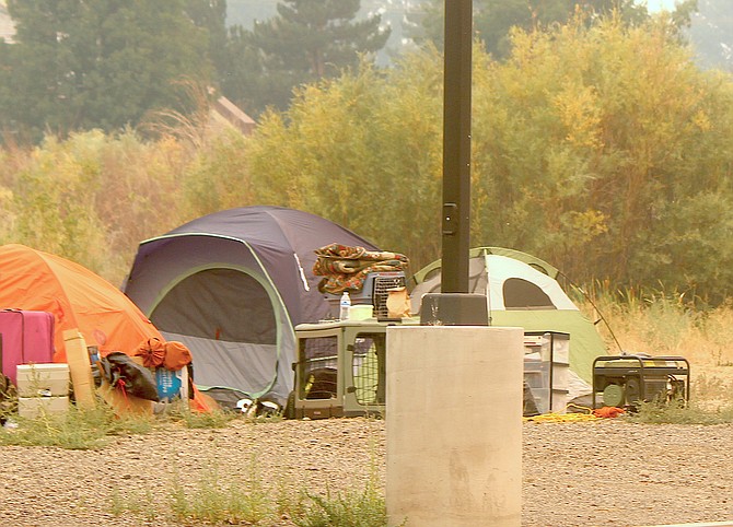 Tents pitched by evacuees from the Caldor Fire at the Douglas County Community & Senior Center, which has reached capacity, county officials said Monday afternoon.