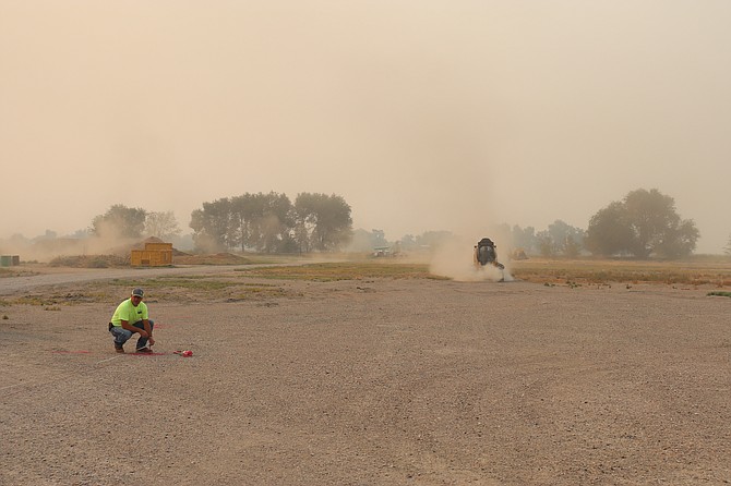 Churchill County Road Department personnel prepare the evacuation site on Aug. 31.