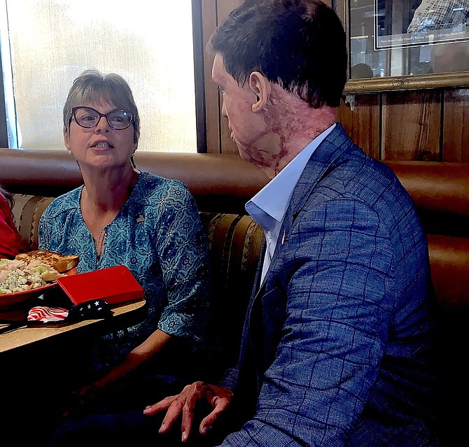 U.S. Senate candidate Sam Brown talks to Lorrie Olson of the Fernley Republican Women.