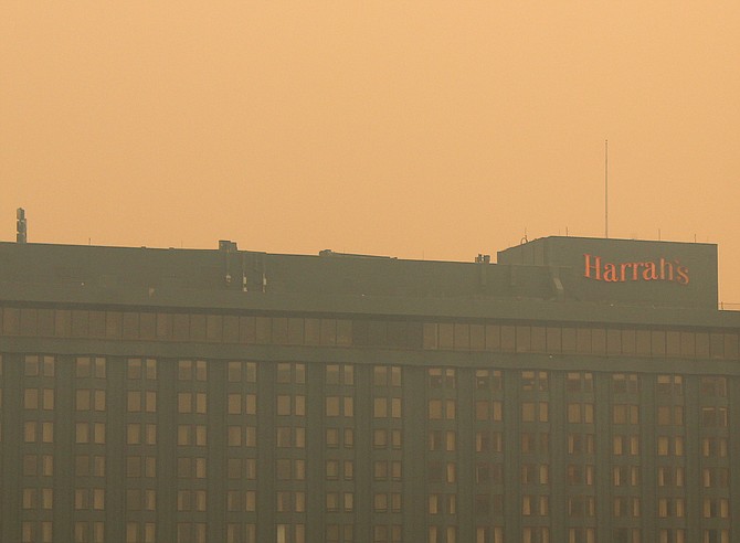 Smoke obscures the Harrah's sign from the MontBleu parking garage on Aug. 26.