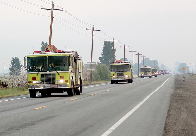 A strike team drives toward the Tamarack Fire on July 18.