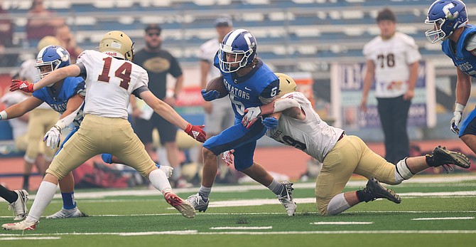 Carson High Running Back Parker Story (6) runs the ball during the game between the Sparks High Railroaders and the Carson High Senators at Carson High School. The Senators will hope to get a full, four quarters worth of gameplay under their belt this Friday at Reno.