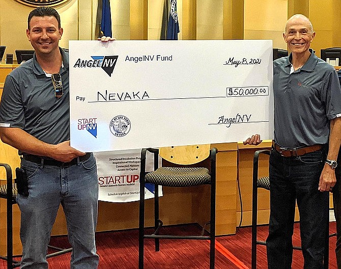 Co-founders Chris Paris, left, and Mark Aston, of Reno-based startup Nevaka, hold their runner-up check after the 2020 AngelNV event. Nevaka was one of two runners-up to receive secondary funding after last year's bootcamp.