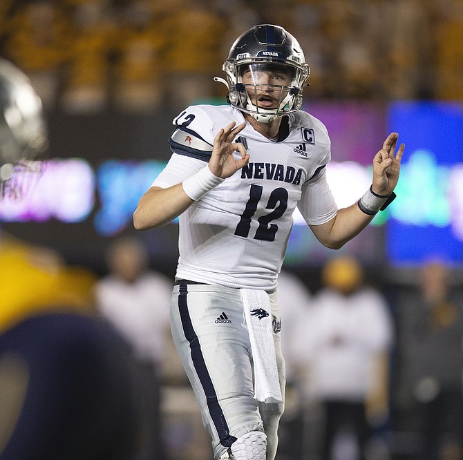 Nevada quarterback Carson Strong signals an audible against California on Saturday in Berkeley.  “I’m pretty confident we’re going to have a good time” against Idaho State, Strong said.  (AP Photo/D. Ross Cameron)