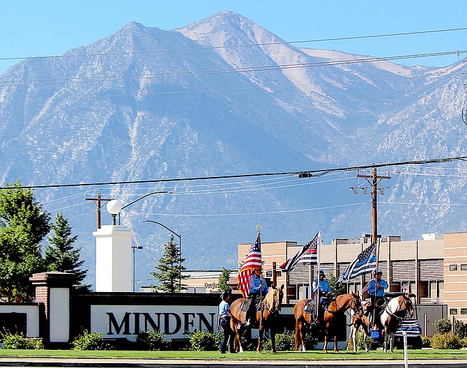 The Douglas County Sheriff's Mounted Posse observes the 20th anniversary of 9-11 in Minden on Saturday.