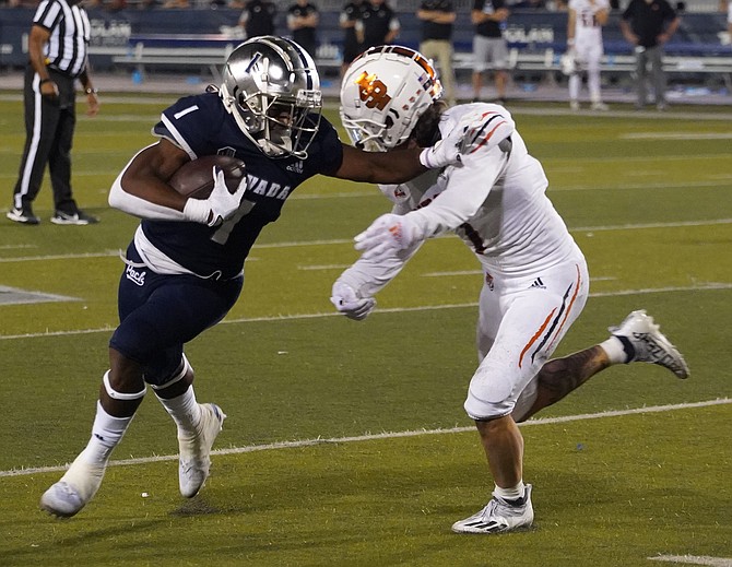 Nevada’s Melquan Stovall races around Idaho State’s Josh Alford during the game Sept 11, 2021 in Reno. (Photo: Thomas Ranson/NNG)