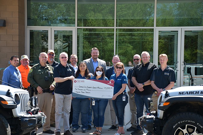 Search and Rescue volunteers with the Sheriff’s Office accept a $5,000 donation from BLUE members, an employee volunteer program through Southwest Gas.