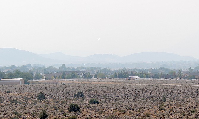 The Pine Nuts are barely visible from Fish Springs Road on Friday afternoon.