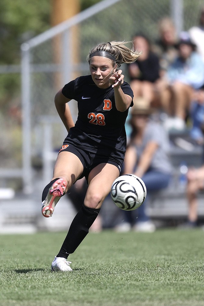 Douglas High's Ava Coons puts a shot on net Saturday. Coons tallied the game winner in the 71st minute to lead the Tigers girls' soccer team past McQueen.