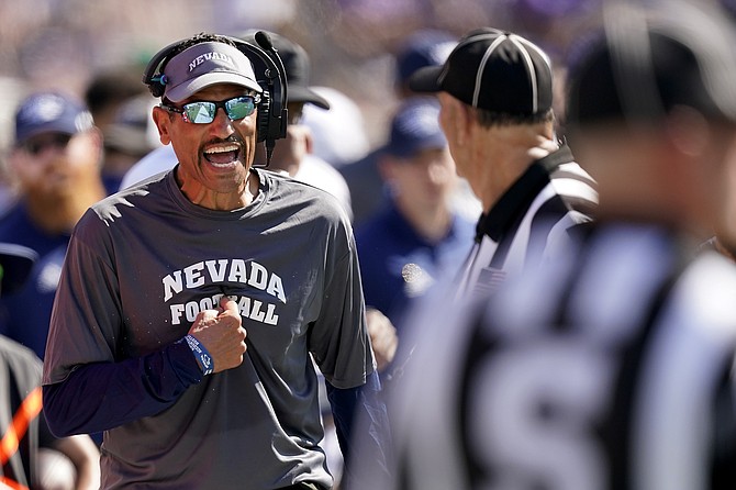Nevada head coach Jay Norvell talks to officials during the second half against Kansas State on Sept. 18, 2021, in Manhattan, Kan. (AP Photo/Charlie Riedel)