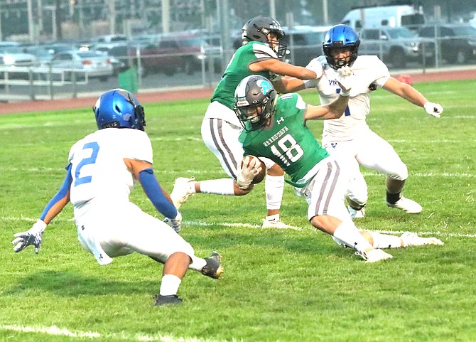 Fallon’s Tyler Austin (18) makes a move toward South Tahoe’s Joel Gomez (20).