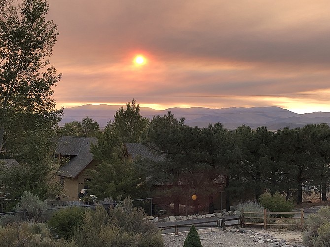 Smoke tinted the sunrise on Tuesday morning in this photo by Foothill resident Margaret Pross. Most of the smoke today is expected to come from the Caldor Fire.