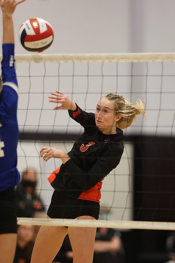 Emerson Dufloth (3) deposits one of her six kills in a four-set win over Carson Thursday night.