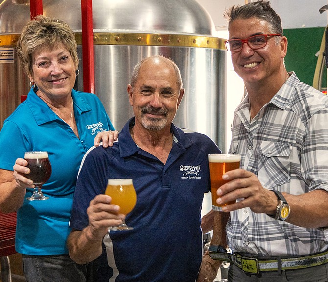 Great Basin Brewing Company founders Tom and Bonda Young raise a glass with restaurateur Mark Estee, right, CEO of Reno-based Local Food Group.