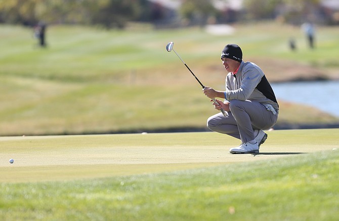 A golfer lines up his putt during the Dayton Valley Golf Club Korn Ferry Tour qualifier in 2019.