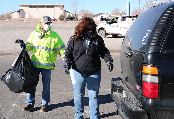 Social service and road department staff distribute wishing tree items to families last December.
Wishing Tree applications now available