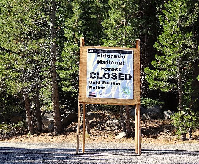 A sign at Carson Pass indicates the Eldorado Forest is closed. Parts are set to reopen today, but there are still a lot of closures due to the Caldor Fire, including Mormon Emigrant Trail.