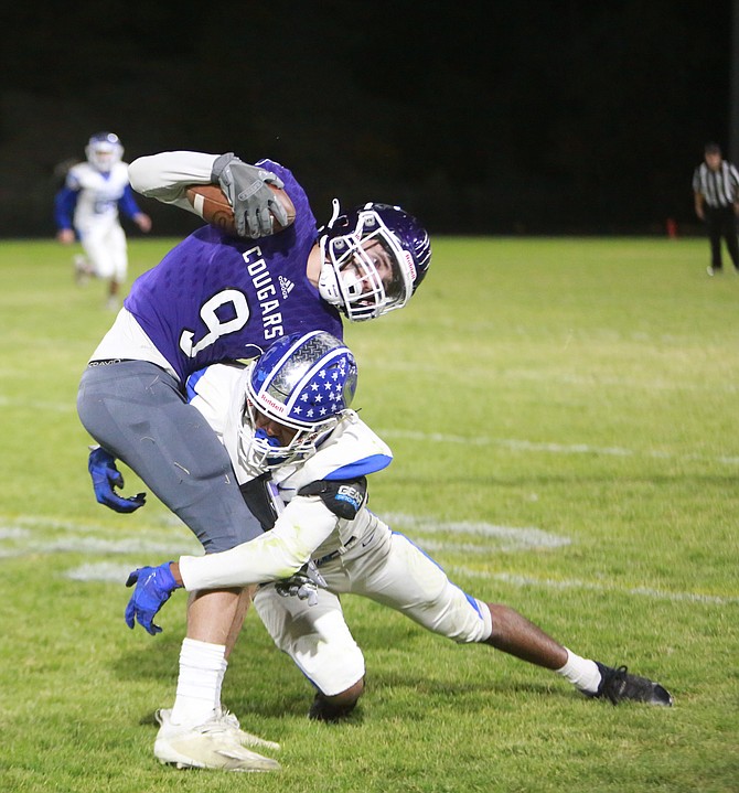 Carson High defensive back Javier Arrellano makes a tackle on the edge Friday night against Spanish Springs. Arrellano was credited with two forced fumbles in the loss.
