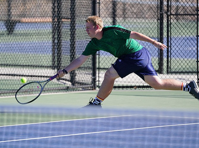 Fallon senior Sativa Clark tips the ball over the net against Fernley on Sept. 29.