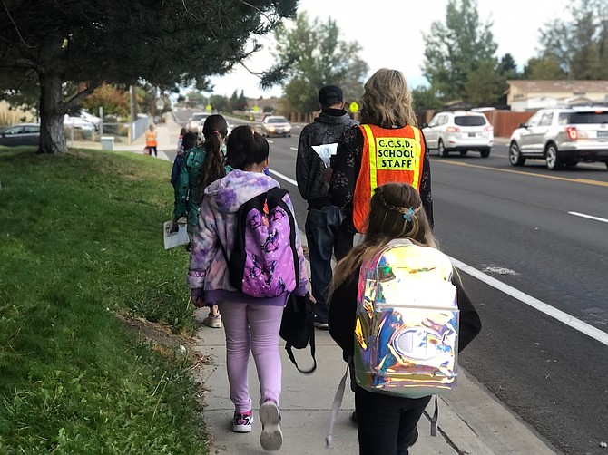 Fremont Elementary School students and staff walk to school Thursday. Courtesy