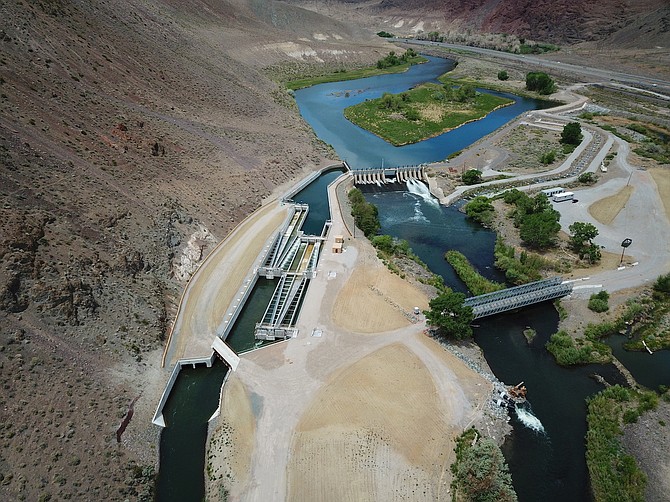 A view looking north shows a flowing Truckee River, the Derby Dam and newly completed fish screens in this 2020 photo.