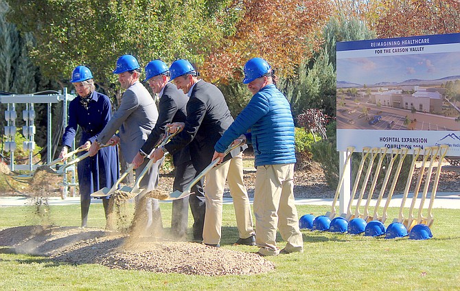 Members of the Carson Valley Medical Center board toss out the first shovel of dirt on Friday morning at the hospital south of Gardnerville