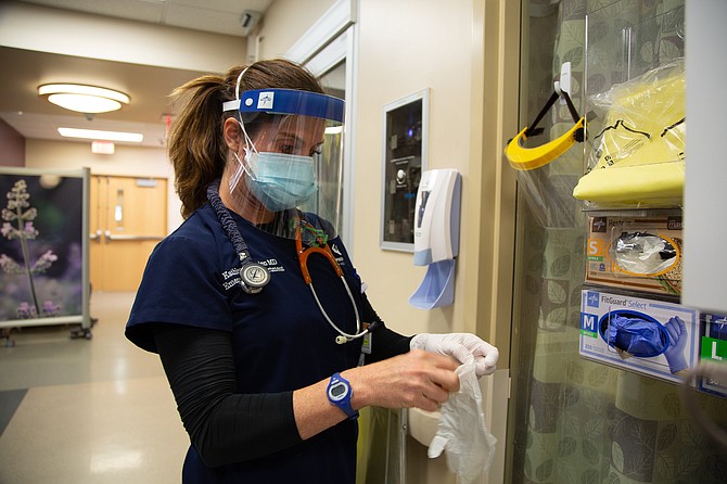 Dr. Kathleen O’Brien, an emergency medicine physician at Carson Tahoe Health, prepares to treat a patient in the emergency department at the Carson Tahoe Regional Medical Center in Carson City.