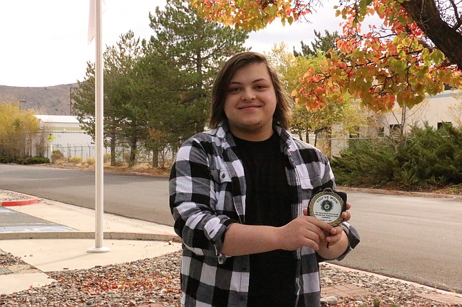 Evan Cherpeski, 20, found the medallion under a rock in Kahle Park near Stateline. He and his family, including his mother Jen, father Jeff, and siblings Ellen and Mason, started looking for the medallion on Friday after Jen saw the treasure hunt in her Facebook feed. (Photo: Faith Evans/Nevada Appeal)