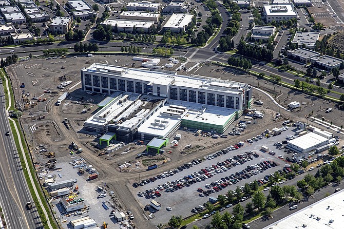An aerial view from the summer of 2021 of construction progress at the new Northern Nevada Sierra Medical Center being built at Double R Boulevard and Longley Lane in South Reno.