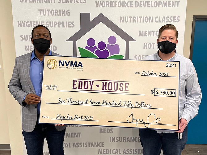 NVMA President Tyre Gray, left, presented the check to Eddy House CEO Trevor Macaluso earlier this month.