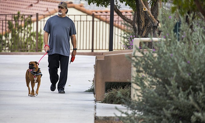 Neil Mayfield walks his dog, Penny, at Madeira Canyon Park in Henderson on Wednesday, Oct. 6, 2021.