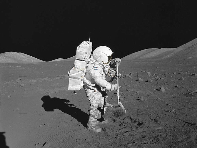 Harrison Schmitt shown standing on the surface of the Moon on the last manned lunar mission.