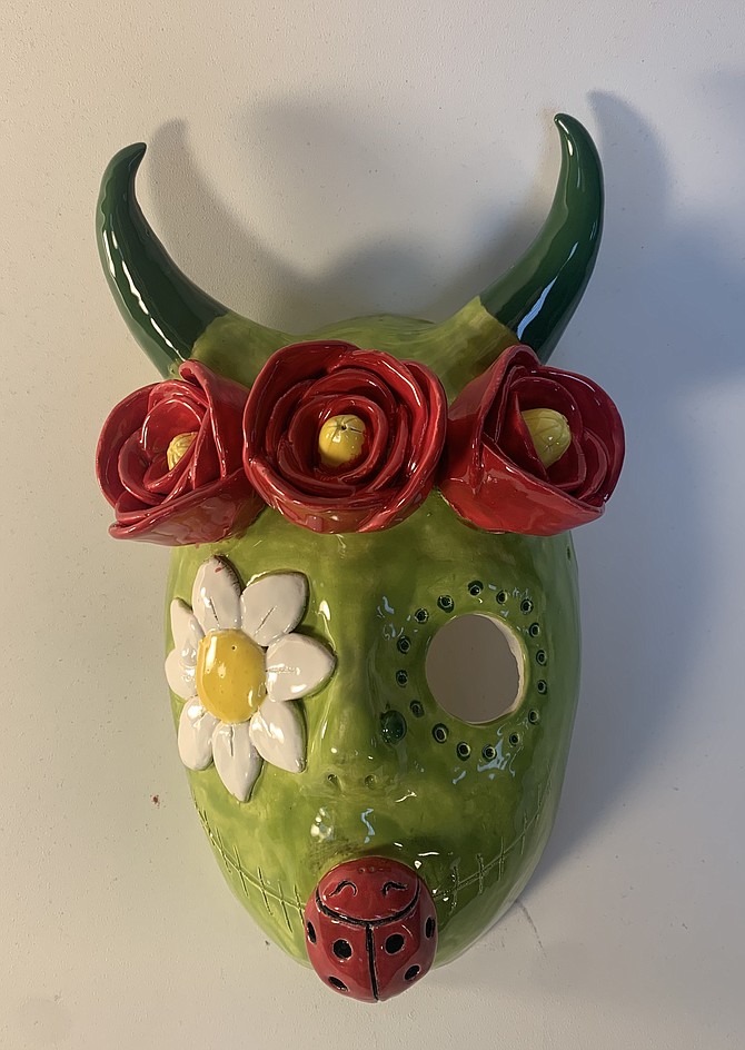 Carson High School seniors Fatima Marquez Mariscal and Vee Wahl from Alisa Kuniya's ceramics class have featured art pieces displayed in a CHS ofrenda at the Nevada State Museum and in the Bristlecone building at Western Nevada College as part of Day of the Dead art exhibits.