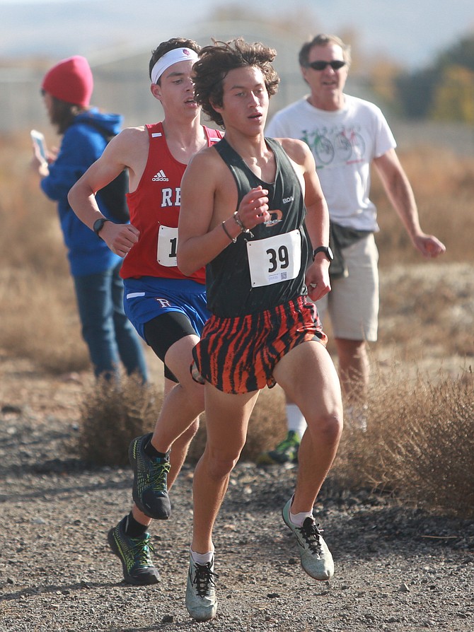 Douglas High’s Jackson Davis runs the downhill portion of the Class 5A regional cross country meet at Shadow Mountain Sports Complex next to Reed High School. Davis finished 10th and qualified for the state meet next Saturday at the same location.