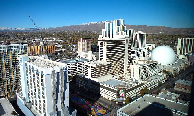 Whitney Peak Hotel, left, and The Row properties — Eldorado, Silver Legacy and Circus Circus — are seen from a window inside the main tower of Reno City Center on Thursday, Oct. 28, 2021.