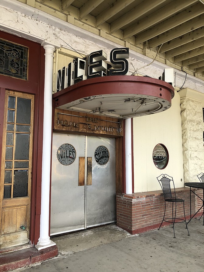 The Art Deco-influenced entrance to the saloon in the historic Niles Hotel in Alturas, California.