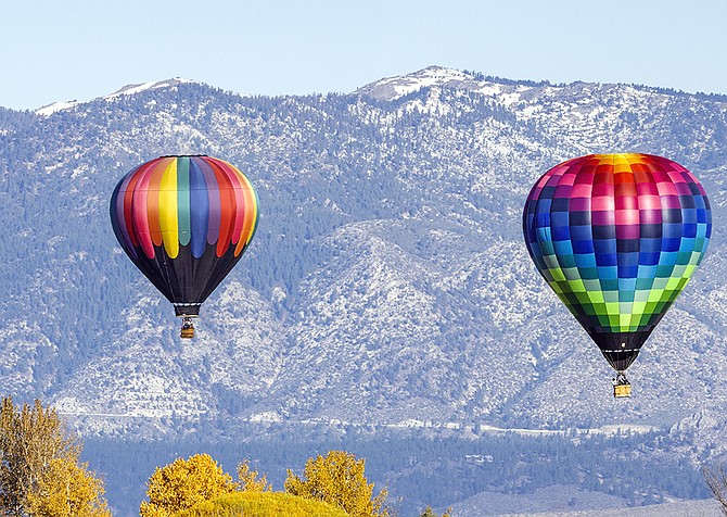 It's more kite-flying than balloon soaring weather this morning. Carson Valley photographer JT Humphrey took this photo of Carson Valley's own dawn patrol on Saturday.