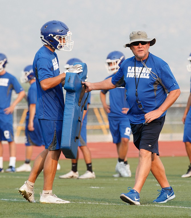 Carson High's Blair Roman walks through a drill at practice with the Senator football team. Roman decided to step down Wednesday after 14 years as head coach with Carson.