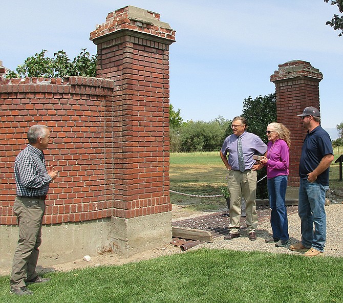 Friends of Dangberg Home Ranch Director Mark Jensen, left, discusses the restoration work planned for the historic gateway pillars with Douglas County Community Services Director Scott Morgan, Smallwood Foundation Trustee Suzy Stockdale and  Douglas County Parks Superintendant Ryan Stanton. The 1917 pillars were designed by noted Nevada architect, Frederick Delongchamps.