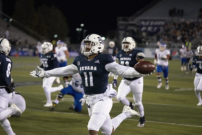 Nevada’s Daiyan Henley reacts as he’s about to cross the goal line on an interception returned for a touchdown Nov. 6, 2021 against San Jose State at Mackay Stadium in Reno. (Photo: Thomas Ranson/NNG)
